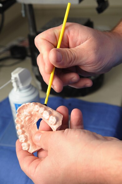 Tech. Sgt. William Fitzpatrick, 2nd Dental Squadron, laboratory technician prepares a patient's diagnostic cast at Barksdale Air Force Base, La., Nov. 9. The cast will be used to mold an athletic mouth guard. The dental clinic offers both general dentistry and special dental treatment for active duty. (U.S. Air Force photo/Senior Airman Brittany Y. Bateman)(RELEASED)