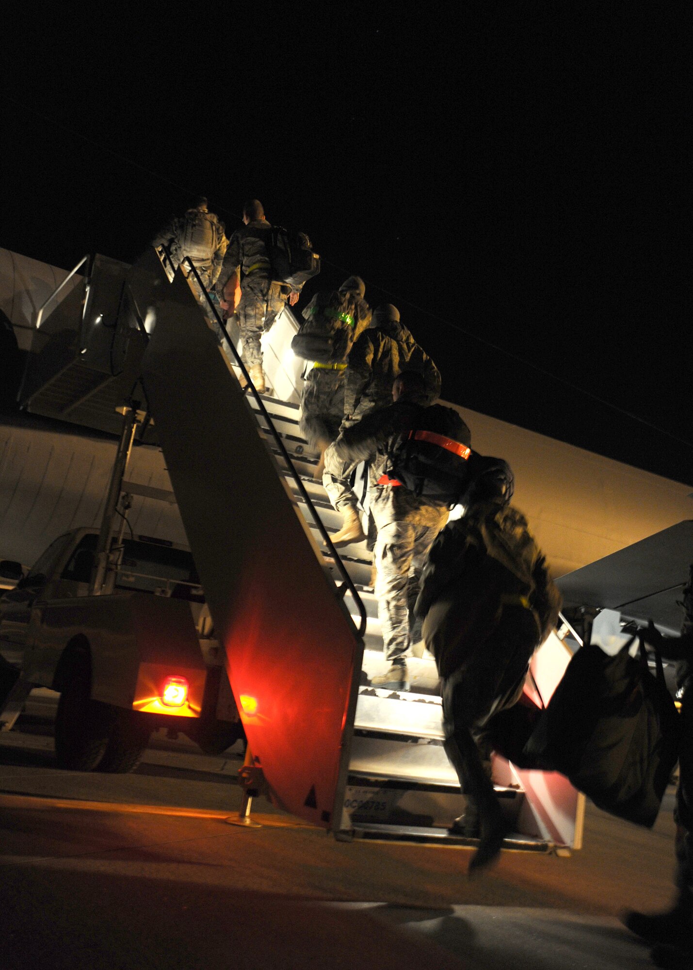 Airmen board a KC-135 Stratotanker during a readiness exercise Nov. 8, 2010, McConnell Air Force Base, Kan.  McConnell Airmen participate in practice deployments so they are ready for real military operations when they are needed.  (U.S. Air Force photo/Staff Sgt. Dallas Edwards)