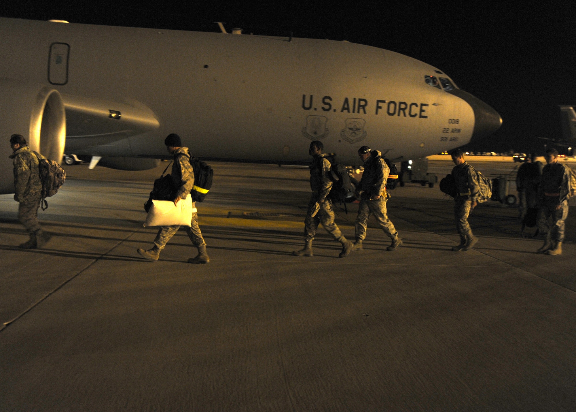 Airmen board a KC-135 Stratotanker during a readiness exercise Nov. 8, 2010, McConnell Air Force Base, Kan.  McConnell Airmen practice deployment readiness skills so that they will be ready to support worldwide Air Force operations at a moment’s notice.  McConnell deployed 76 Airmen during the exercise.  (U.S. Air Force photo/Staff Sgt. Dallas Edwards)