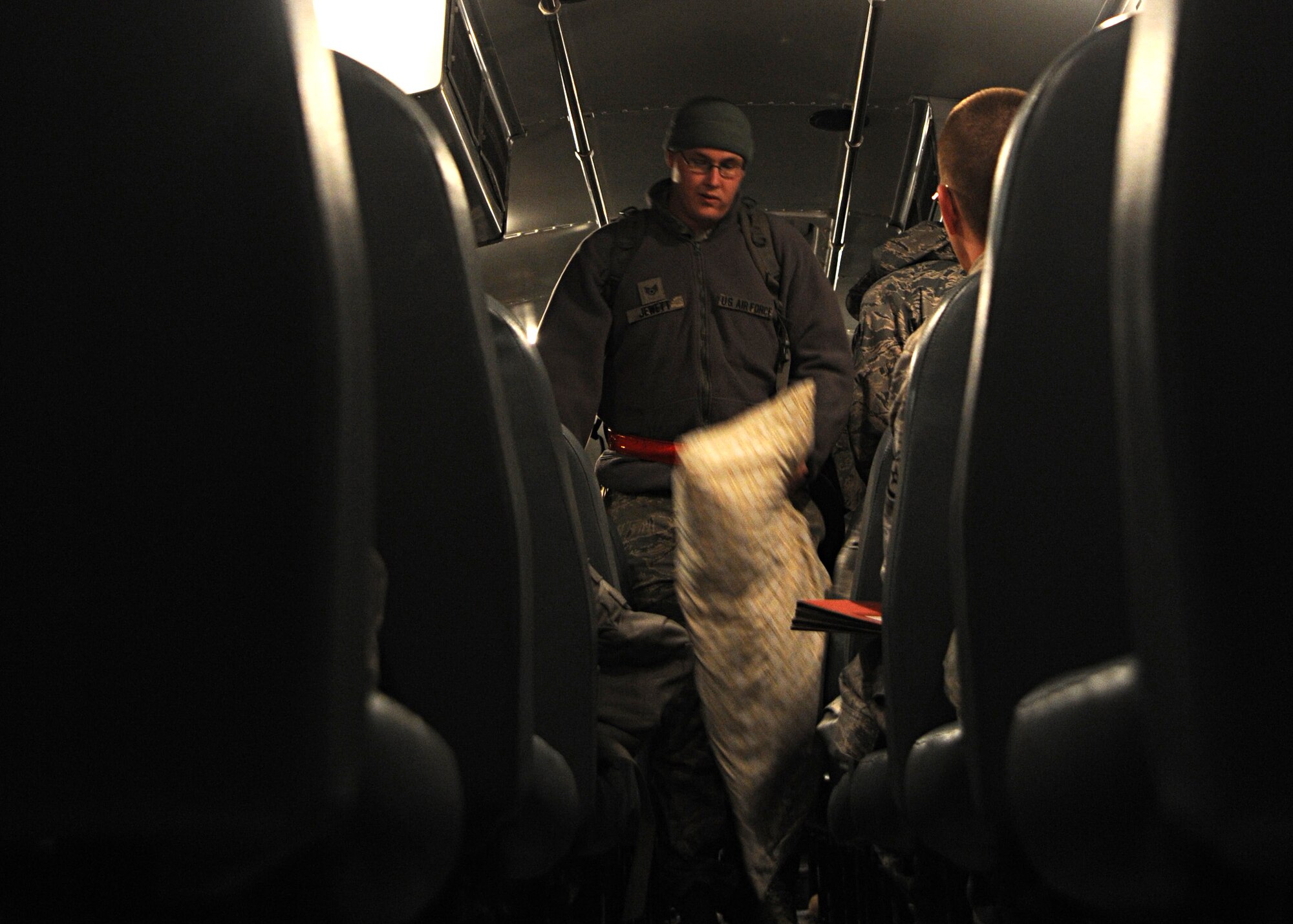 Staff Sgt. Jeremy Jewett, 22nd Maintenance Squadron aircraft structural maintenance craftsman, boards a bus travelling to load deploying Airmen on a KC-135 Stratotanker during a readiness exercise Nov. 8, 2010, McConnell Air Force Base, Kan.  (U.S. Air Force photo/Staff Sgt. Dallas Edwards)