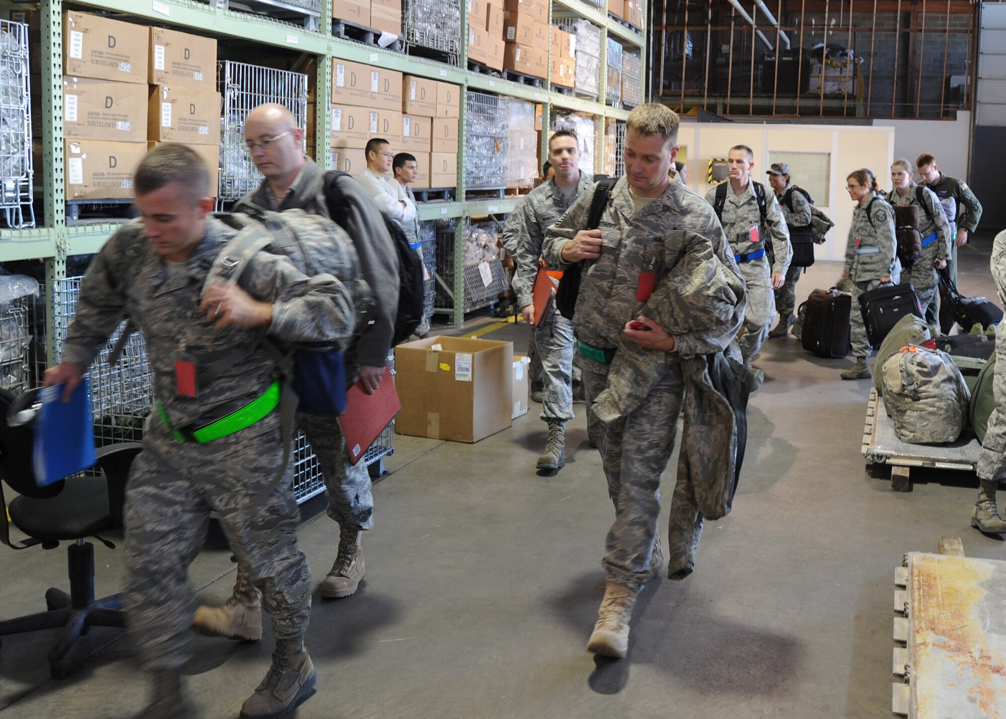 Airmen prepare to deploy as part of a readiness exercise Nov. 7, 2010, McConnell Air Force Base, Kan.  McConnell Airmen must be ready to deploy worldwide at a moment’s notice and they participate in periodic exercises to practice that capability.  McConnell deployed 76 Airmen during the exercise.  (U.S. Air Force photo/Staff Sgt. Dallas Edwards)