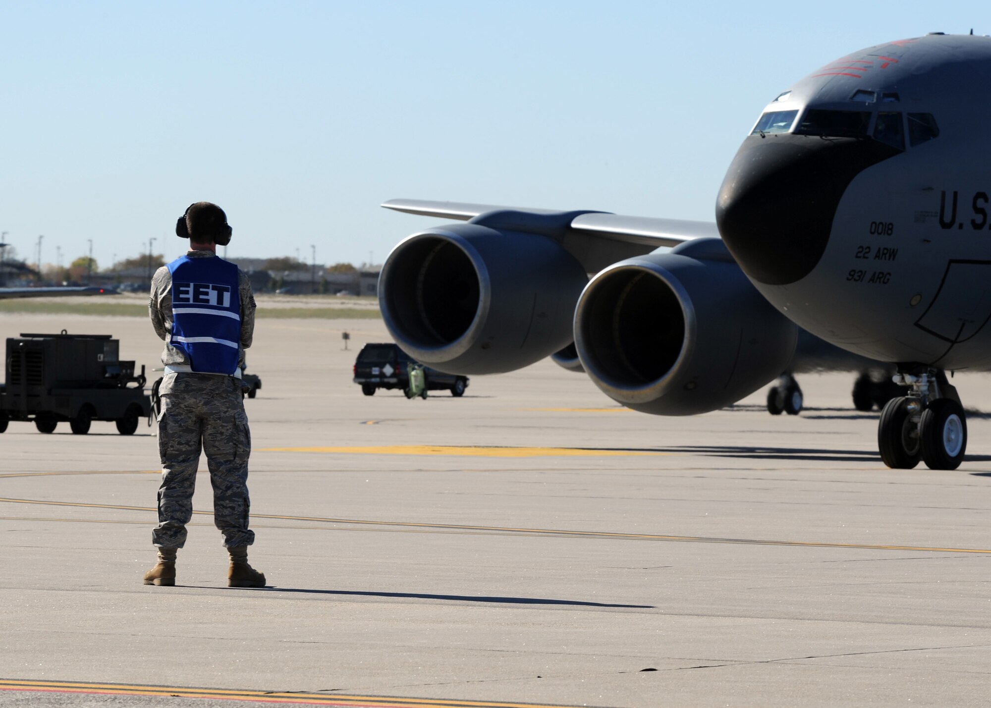 An exercise evaluation team member observes flightline operations during a readiness exercise Nov. 6, 2010, McConnell Air Force Base, Kan. The exercise evaluation team observes and grades the performance of exercise participants to ensure established procedures are followed. (U.S. Air Force photo/Staff Sgt. Dallas Edwards)  