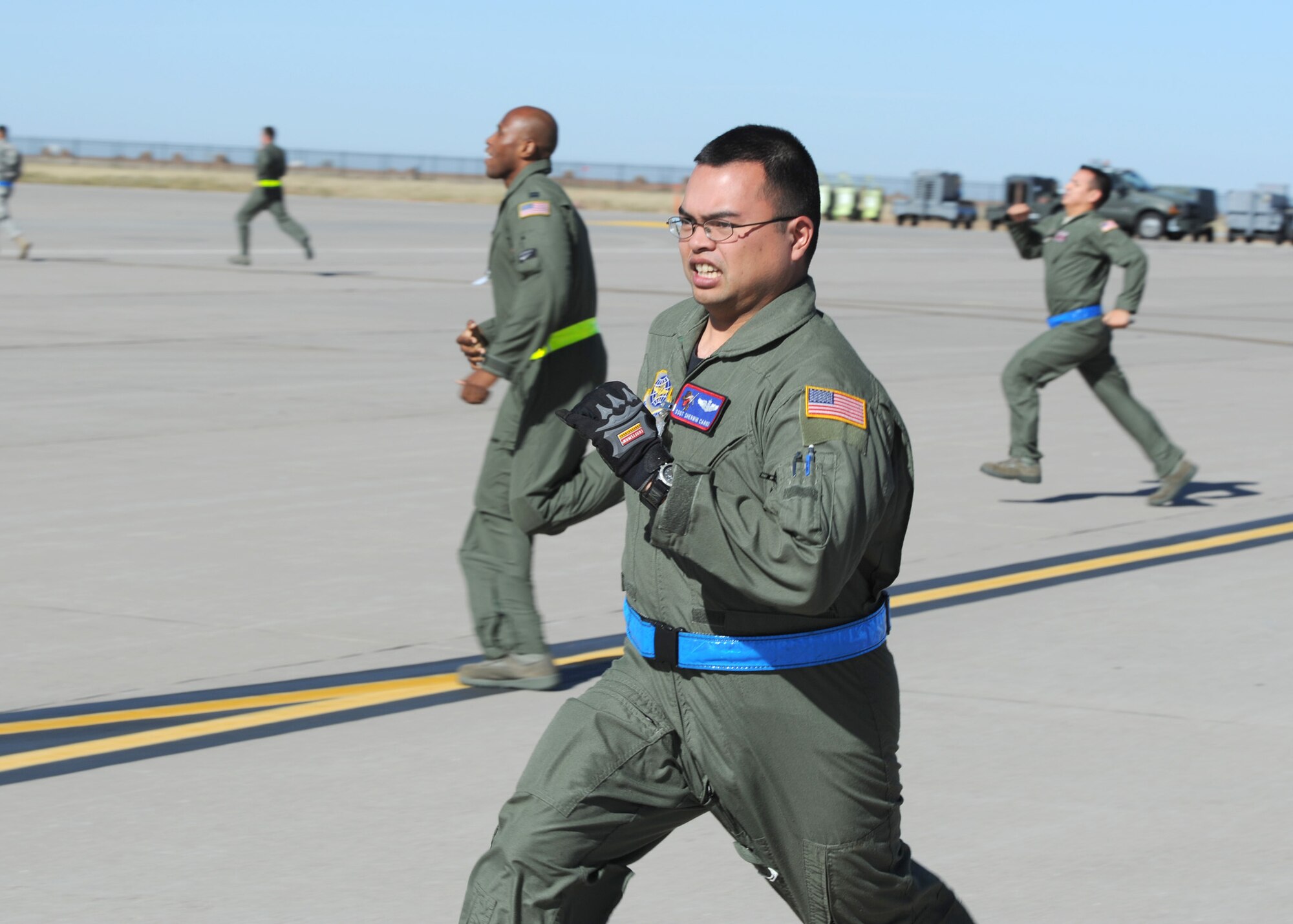 Staff Sgt. Sherwin Carino, 349th Air Refueling Squadron instructor/boom operator, runs to a KC-135 Stratotanker after receiving an alert call Nov. 6, 2010, McConnell Air Force Base, Kan. The crewmembers responded during a readiness exercise to support U.S. Strategic Command. (U.S. Air Force photo/Staff Sgt. Dallas Edwards)