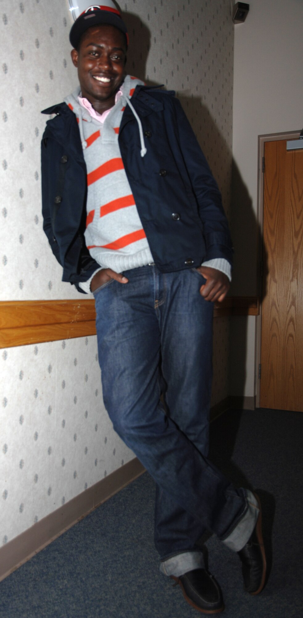 Airman 1st Class Carlos Eggleston, 319th Comptroller Squadron, models his signature style in Barnes Hall Nov. 9, before meeting up with his friends. Airman Eggleston is the Warrior of the Week for Nov. 8 through Nov. 12. (U.S. Air Force photo by Airman 1st Class Rachel Waller) 