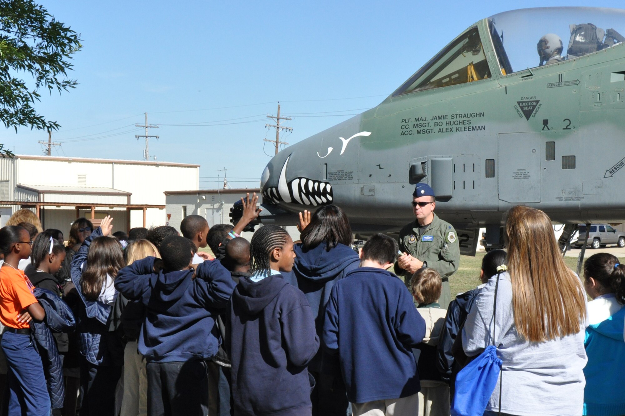 Lt. Col. Peter Olson, a Regular Air Force instructor pilot assigned to the 47th Fighter Squadron, fields questions from a group of Meadowview Elementary School 5th Grade students during a briefing about the A-10 Thunderbolt II at Barksdale Air Force Base, La., Nov. 8, 2010. The students are attending STARBASE Louisiana, at Barksdale, one of 60 national STARBASE sites. It is sponsored by the 917th Wing of the Air Force Reserve Command. The program presents an exciting 25-hour hands on/minds on aviation and aerospace curriculum to area 5th grade students and their teachers. The DoD program is committed to addressing the critical needs in STEM education - Science, Technology, Engineering and Mathematics - STARBASE Louisiana introduces its students to exciting STEM education topics, inspiring these young minds to further explore these topics in future course work. Meadowview Elementary is part of the Bossier Parish School System. (U.S. Air Force photo/Tech. Sgt. Jeff Walston)