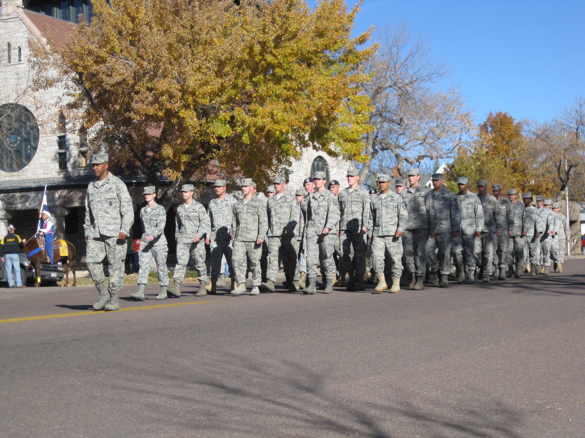 COLORADO SPRINGS, Colo. -- Lt. Col. Elvert Gardner, 76th Space Control Squadron commander, leads a flight of 21st Space Wing Airmen in the Colorado Springs Veterans Day parade Nov. 6 in downtown Colorado Springs. The parade honored all veterans for the sacrifices they have made in defending our freedoms, and thousands lined Tejon Street to honor the vets. (U.S. Air Force photo/Steve Brady)