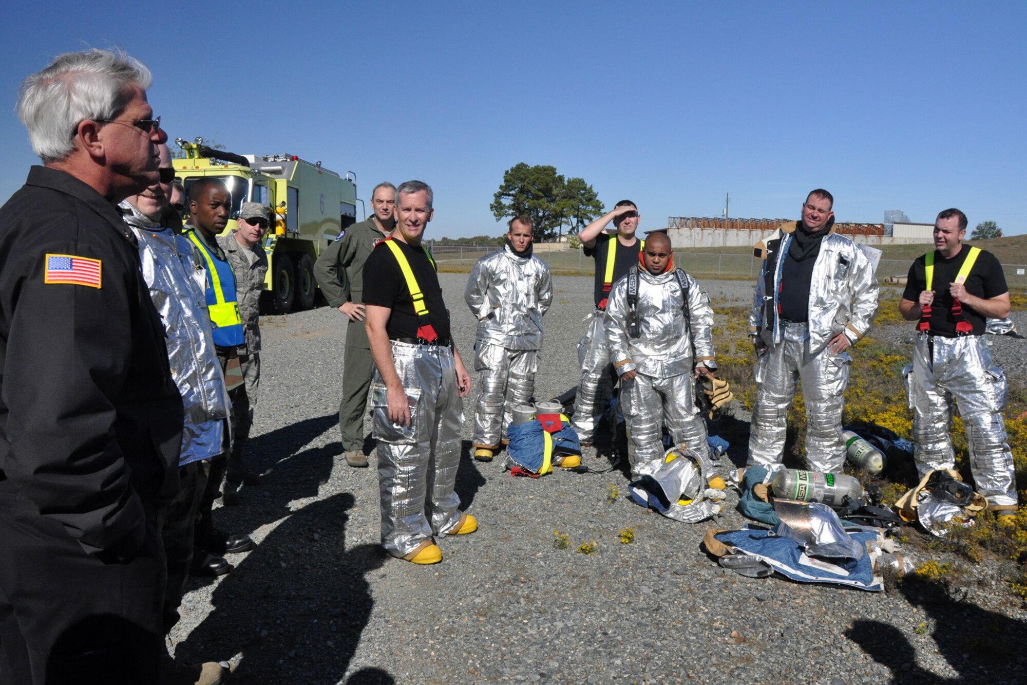 Bruce Rhein, assistant chief for training, 2nd Civil Engineer Squadron/Fire Emergency Services, discusses the performance of 917th Civil Engineer Squadron firefighters after they completed a morning of annual wartime training at Barksdale Air Force Base, La., Nov. 5, 2010. The 917 CES firefighters were working on their annual Air Force Certification process for Airport Rescue Firefighting.  (U.S. Air Force photo/Tech. Sgt. Jeff Walston) 

