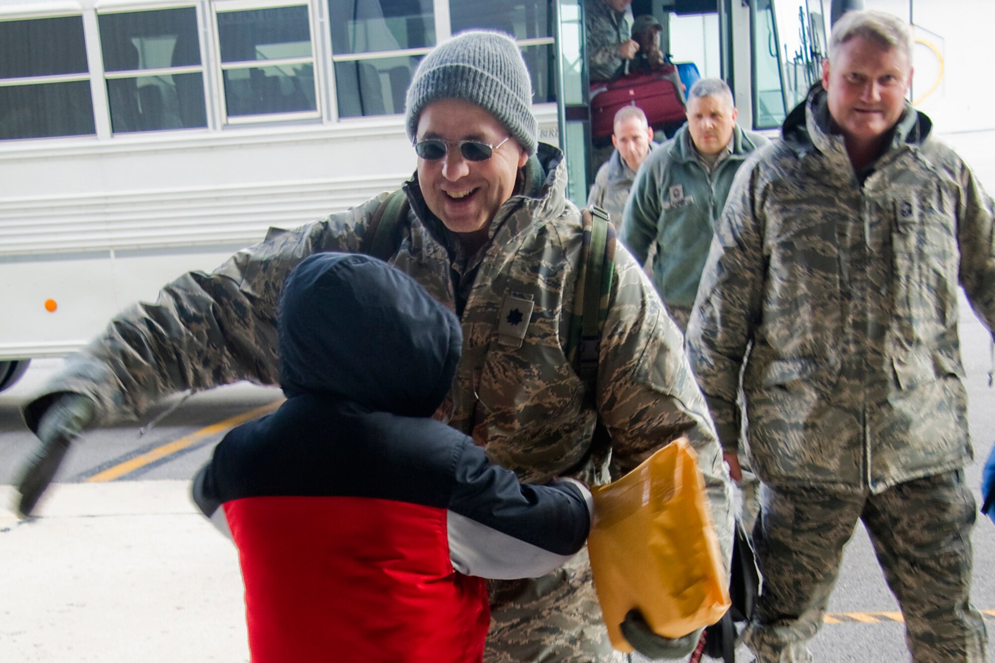 GRISSOM AIR RESERVE BASE, Ind. -- Lt. Col. Greg Schultz rushes to give one of his sons a hug after returning from a recent deployment Nov. 1. Colonel Schultz, a senior intelligence officer with the 434th Operations Group returned home with other Grissom Airmen after being deployed. (U. S. Air Force photo/Tech. Sgt. Mark R. W. Orders-Woempner)