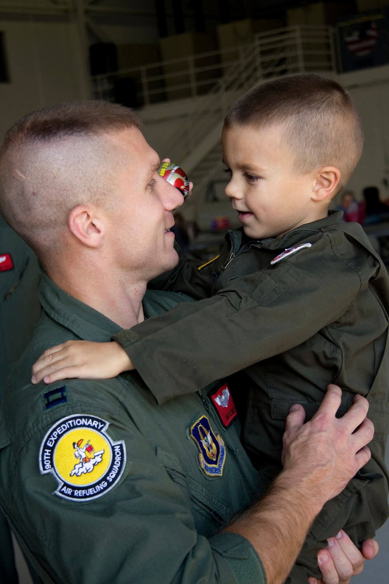 GRISSOM AIR RESERVE BASE, Ind. -- Capt. Daniel Keeney shares a moment with his son Jonathan, 4, after returning home from a recent deployment Nov. 2. Captain Keeney, 434th Operations Support Squadron assistant director of training, and other Grissom Airmen recently returned home to their loved ones from deployments around the world. (U. S. Air Force photo/Tech. Sgt. Mark R. W. Orders-Woempner)