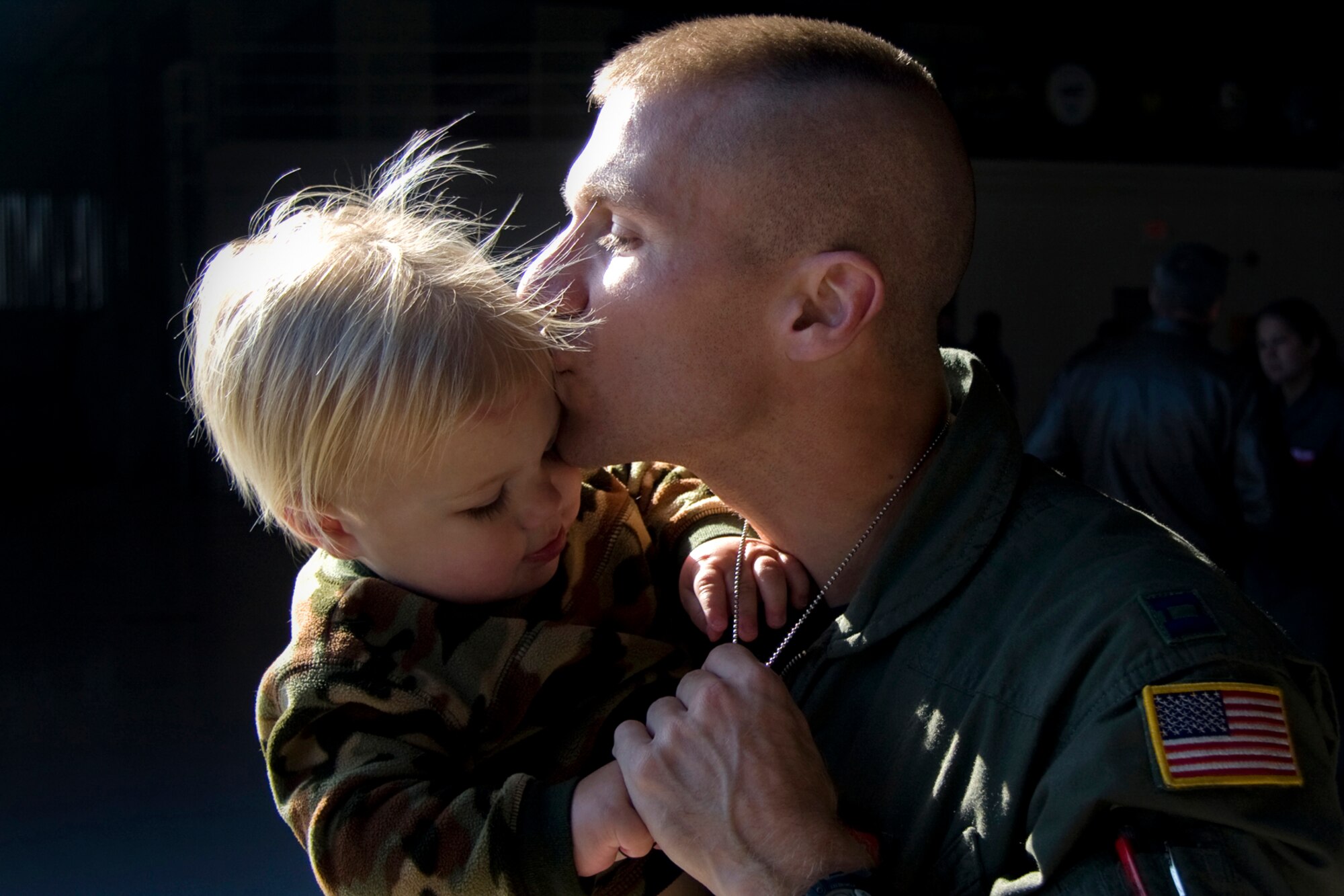 GRISSOM AIR RESERVE BASE, Ind. -- Capt. Daniel Keeney kisses his son Daniel, 1, after returning from a recent deployment Nov. 3. Captain Keeney, 434th Operations Support Squadron assistant director of training, and other Grissom Airmen recently returned home to their loved ones from deployments around the world. (U. S. Air Force photo/Tech. Sgt. Mark R. W. Orders-Woempner)