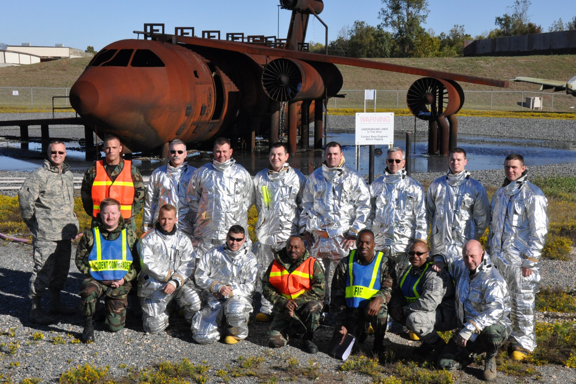 Firefighters with the 917th Civil Engineer Squadron pose for a group picture before beginning annual wartime training on Barksdale Air Force Base, La., Nov. 5, 2010. Approximately 20 members of the 917 CES were involved in this phase, which included extinguishing fires on a large frame aircraft trainer. It was a part of their annual Air Force Certification process for Airport Rescue Firefighting.  (U.S. Air Force photo/Tech. Sgt. Jeff Walston) 

