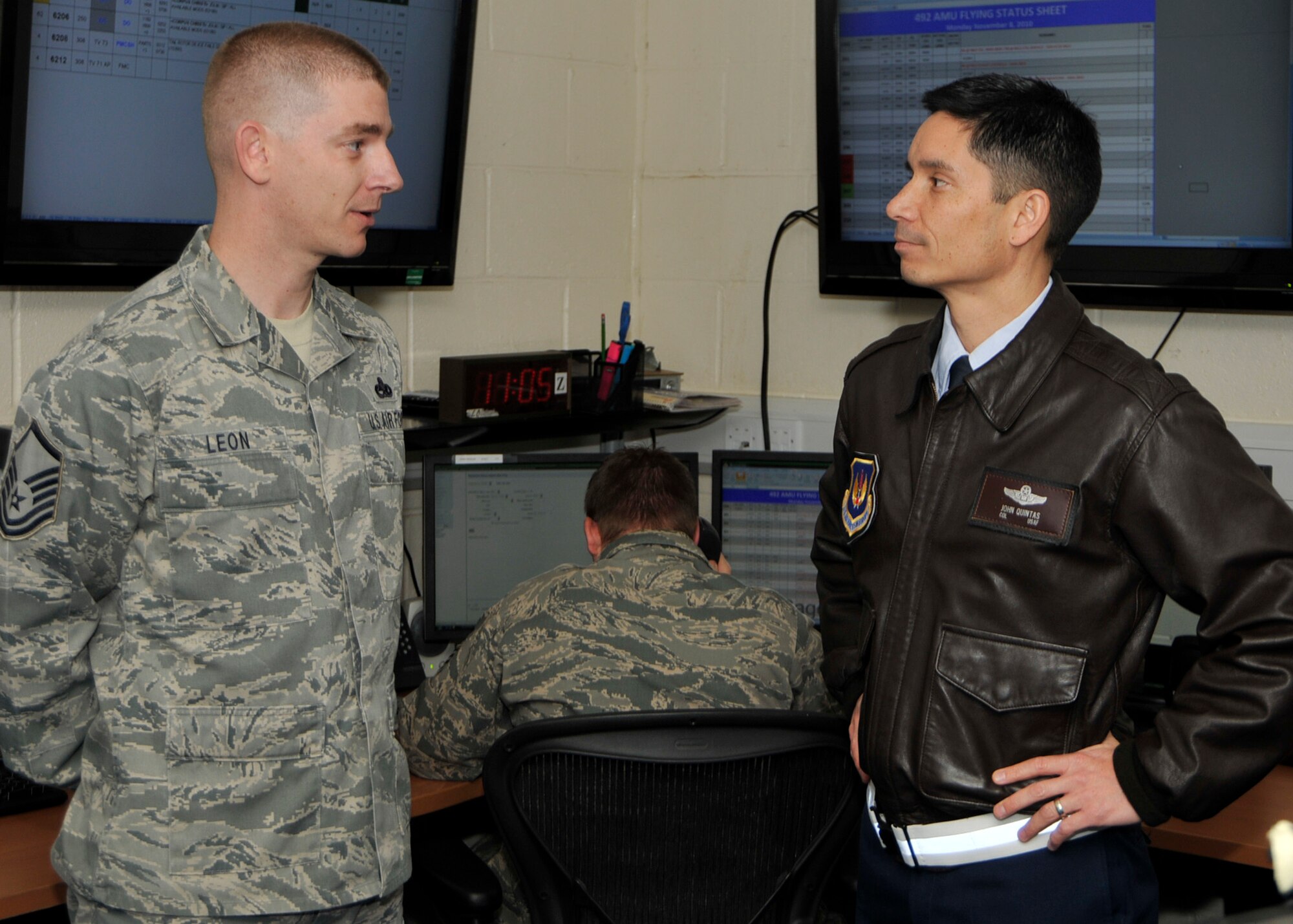 ROYAL AIR FORCE LAKENHEATH, England – Master Sgt. Michael Leon, 48th Maintenance Operations Squadron NCO in charge of Maintenance Operations Center, (left), speaks with 48th Fighter Wing Commander Col. John Quintas during his visit to the MOC on Nov. 8. (U.S. Air Force photo/Airman 1st Class Tiffany M. Deuel)