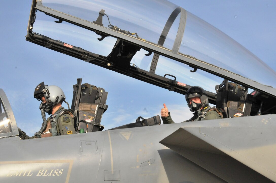 CAMPIA TURZII AIR BASE, Romania – Senior Master Sgt. Michael Seelhoff, 493rd Aircraft Maintenance Unit NCO in charge, gives a thumbs-up before taking off in an F-15C Eagle on the first incentive flight of his 25-year career. Piloting the aircraft is Lt. Col. Skip Pribyl, 493rd Fighter Squadron commander. (U.S. Air Force photo/Senior Airman David Dobrydney)