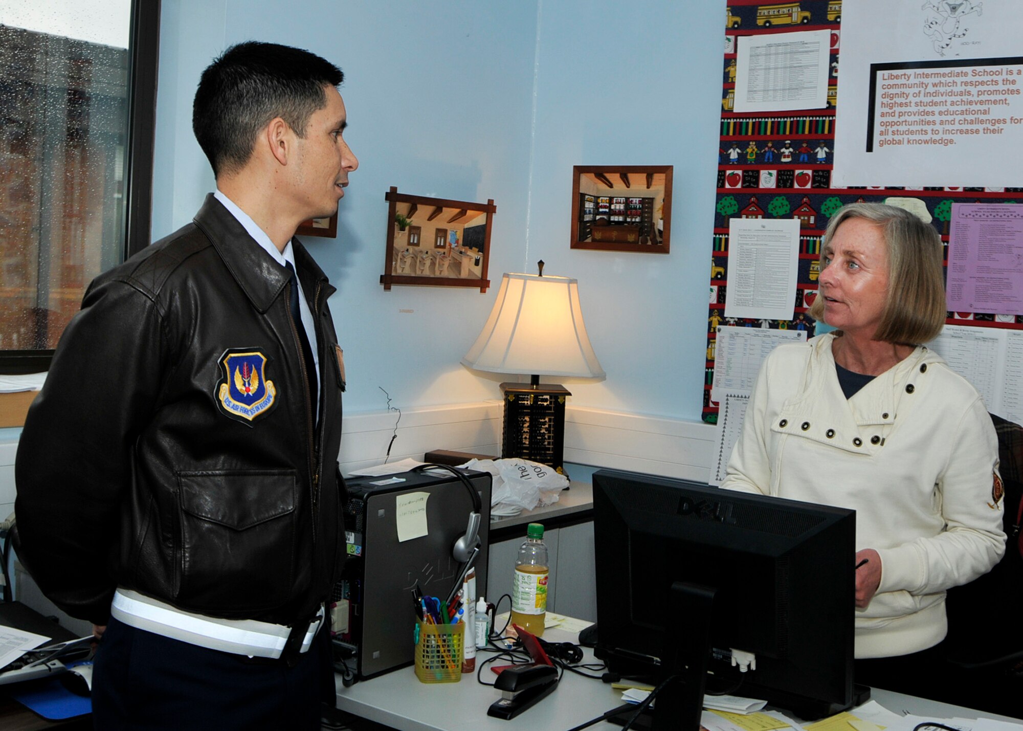 ROYAL AIR FORCE LAKENHEATH, England – 48th Fighter Wing Commander Col. John Quintas speaks with Mrs. Sandy McClosky, educational technologist, at the Lakenheath Intermediate School during a visit on Nov. 8. (U.S. Air Force photo/Airman 1st Class Tiffany M. Deuel)