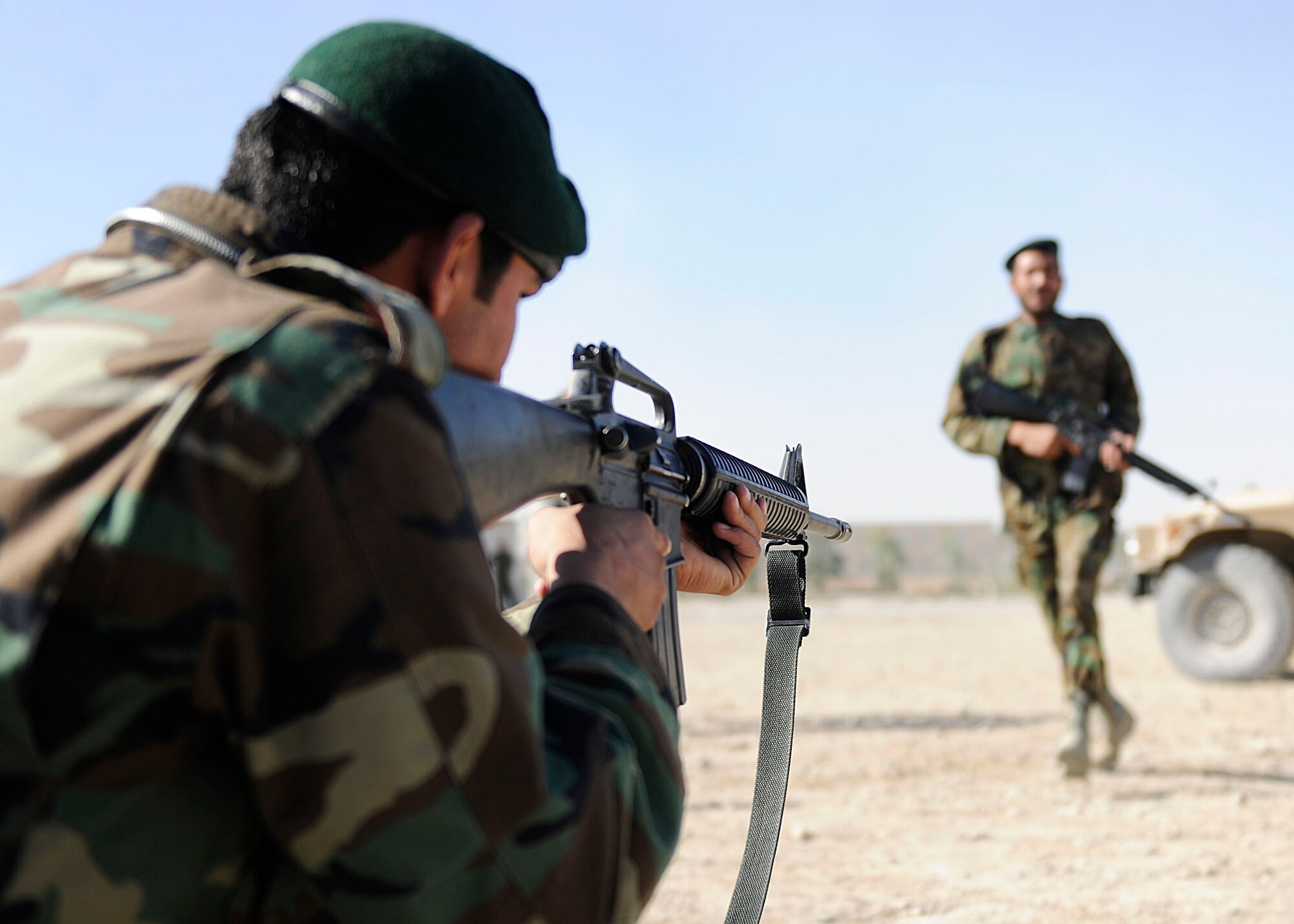 KANDAHAR AIRFIELD, Afghanistan -  Afghan Air Force members from the Kandahar Air Wing Security Kandak practice dismounted Humvee operations at Kandahar Airfield, Afghanistan, Nov. 7. U.S. Air Force members from the 443rd Air Expeditionary Advisory Squadron have been mentoring Afghan soldiers on techniques and tactics of becoming part of a quick-response force. (U.S. Air Force photo by Senior Airman John D. Strong II / 16th Mobile Public Affairs Detachment)