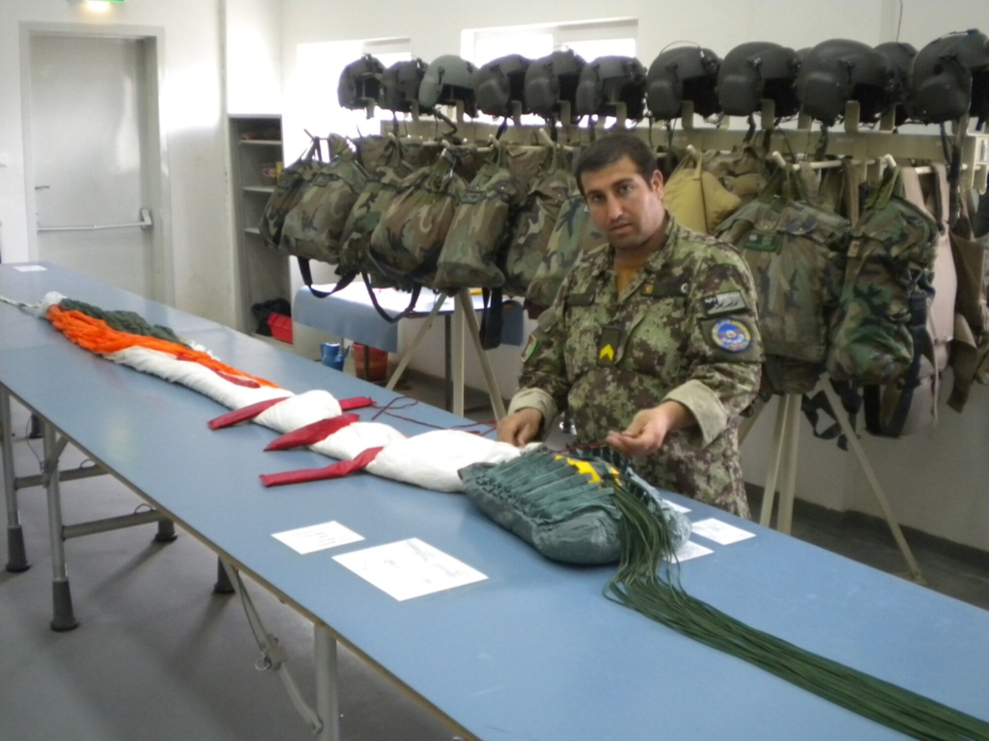 KABUL, Afghanistan - Members of the Afghan Air Force Life Support practice rigging parachuted on Nov 4.  (U.S. Air Force photo by Capt. Rob Leese/RELEASED).
