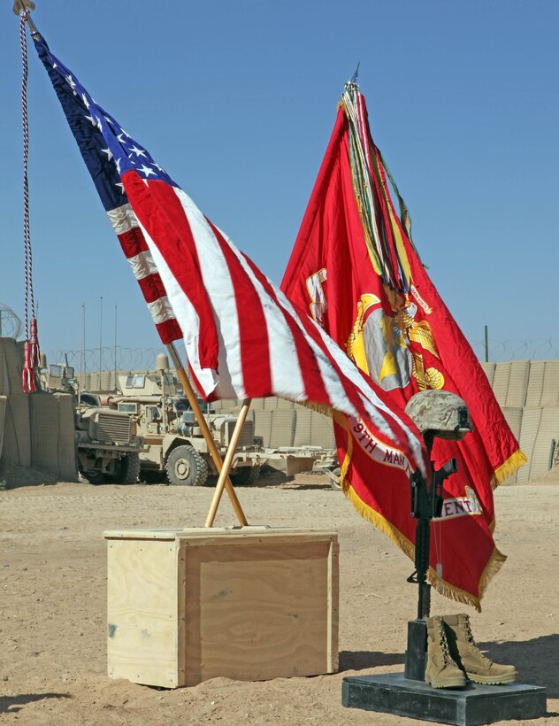 A strong breeze blows through a battlefield cross display honoring Lance Cpl. Terry E. Honeycutt Jr., a machine-gunner with Fox Company, 2nd Battalion, 9th Marine Regiment, during a memorial service at a Marine Corps Base in Helmand Province, Afghanistan, Nov. 11. Honeycutt gave the ultimate sacrifice, Oct. 27, while conducting combat operations in Northern Marjah.