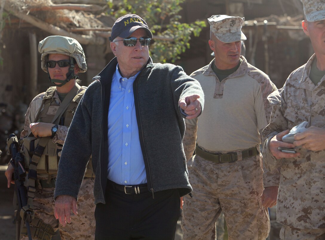 Senator John McCain explores Nawa, Nov. 11, with an entourage of Marines throughout Regional Command Southwest, including Col. David Furness, the commanding officer or Regimental Combat Team 1, who appears behind and to the right of McCain.
