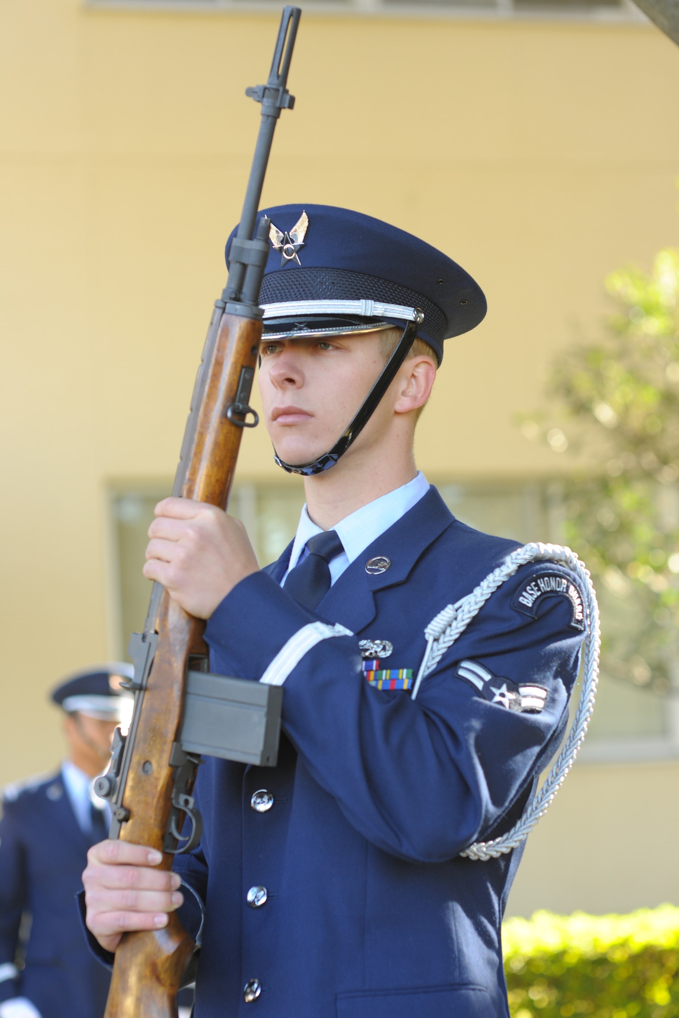 YOKOTA AIR BASE, Japan -- Airman 1st Class Derek Hopkins, 374th Maintenance Squadron, holds a gun after performing three volleys of gunfire to salute all veterans here Nov. 11.  Yokota Airmen, Boy Scouts, the Yokota chapter of the Veterans of Foreign Wars and American Legion Post 2222 participated in the 374th Airlift Wing's Veterans Day Ceremony. (U.S. Air Force photo/Osakabe Yasuo)