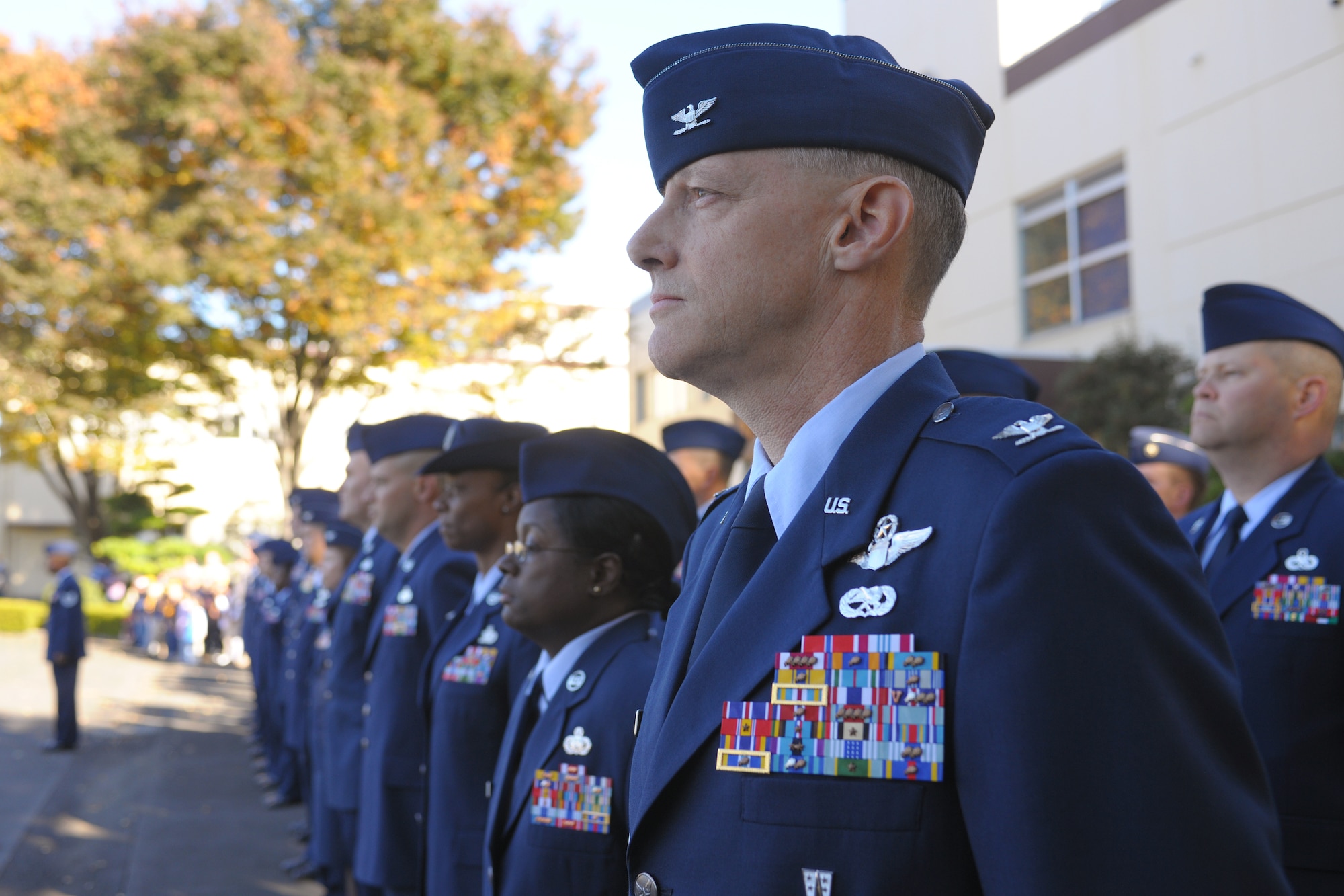 YOKOTA AIR BASE, Japan -- Col. Otto Feather, 374th Airlift Wing commander, observes the flag folding ceremony here, Nov. 11 during the wing Veterans Day ceremony. (U.S. Air Force photo/Osakabe Yasuo)