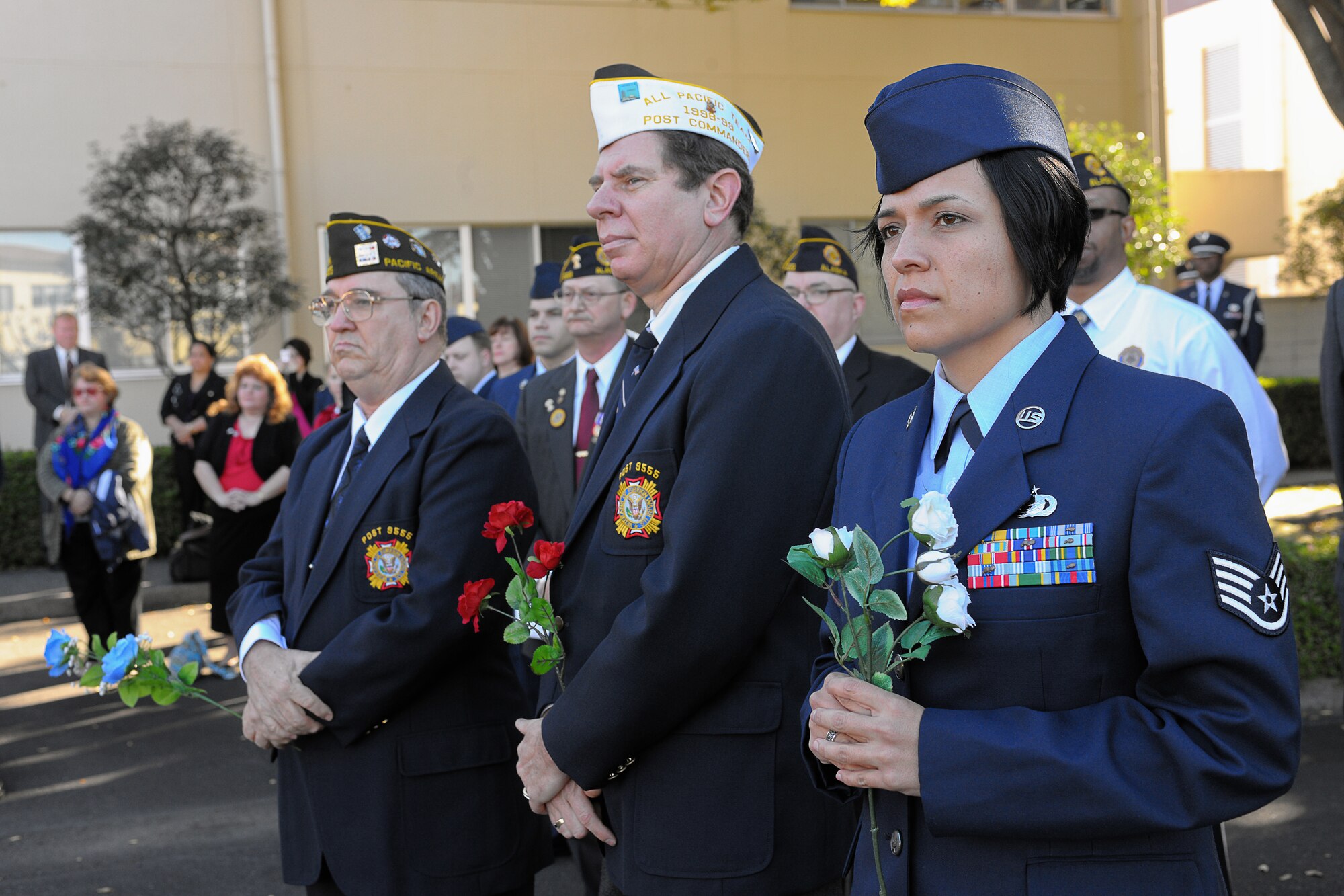 YOKOTA AIR BASE, Japan -- Staff Sgt. Sonora Vasquez, 374th Force Support Squadron, and members from the Yokota chapter of the Veterans of Foreign Wars and American Legion Post 2222 prepare for presenting flowers to the monument here Nov. 11 during the wing Veterans Day Ceremony. (U.S. Air Force photo/Osakabe Yasuo)