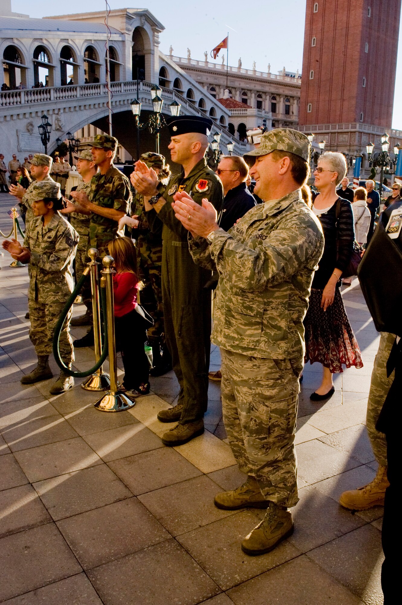 LAS VEGAS -- Col. Steven Winklmann, 99th Air Base Wing vice commander, and Lt. Col. Ron Stefanik, 926th Group commander, applaud for the wounded Gulf War veterans as the walk through the welcome line for their all expenses paid vacation at The Venetian, Nov. 11, 2010. This weekend getaway was planned by ThanksUSA, an organization created in an effort to thank the men and women of our armed forces and their families for their service to the country with scholarship programs and events like the "Tribute to the Troops." (U.S. Air Force Photo / Airman 1st Class Jamie Nicley) (Released)