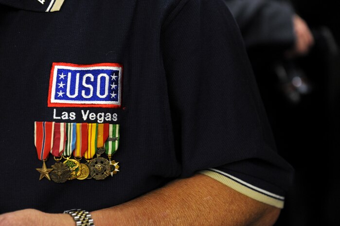 LAS VEGAS -- A USO volunteer and Veteran wears military decorations on his shirt during the USO grand opening at McCarran International Airport, Nov. 11. (U.S. Air Force Photo by Senior Airman Brett Clashman/Released)
