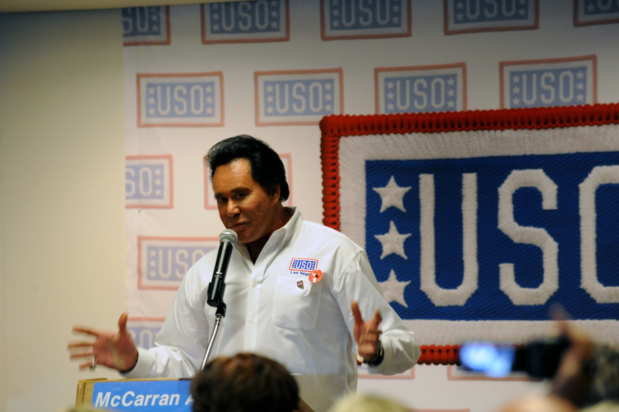 LAS VEGAS -- Mr. Wayne Newton, singer and entertainer, gives a speech during the USO grand opening at McCarran International Airport, Nov. 11. (U.S. Air Force Photo by Airman 1st Class Matthew Lancaster/Released)
