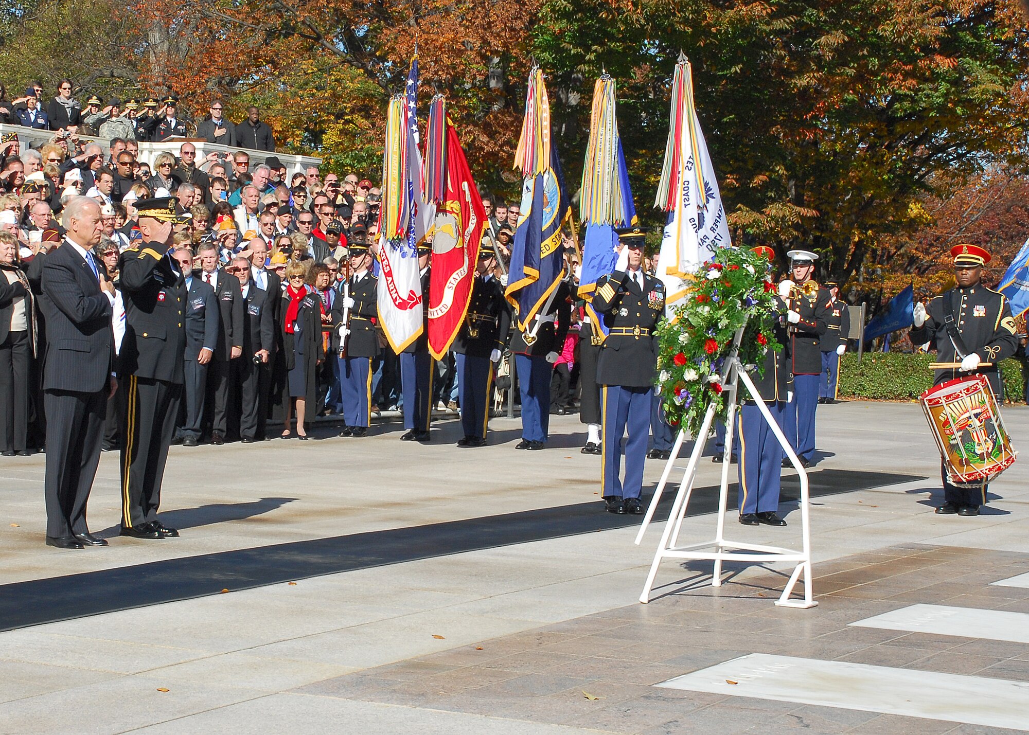 Vice President Joe Biden and Maj. Gen. Karl Horst, commander of the Army Military District of Washington, pay their respects Nov. 11, 2010, as Taps is played at the Tomb of the Unknowns during the Veterans Day ceremony at Arlington National Cemetery in Arlington, Va. Many senior Department of Defense leaders attended the event along with hundreds of visitors and veterans. (U.S. Air Force photo/Master Sgt. Raheem Moore)