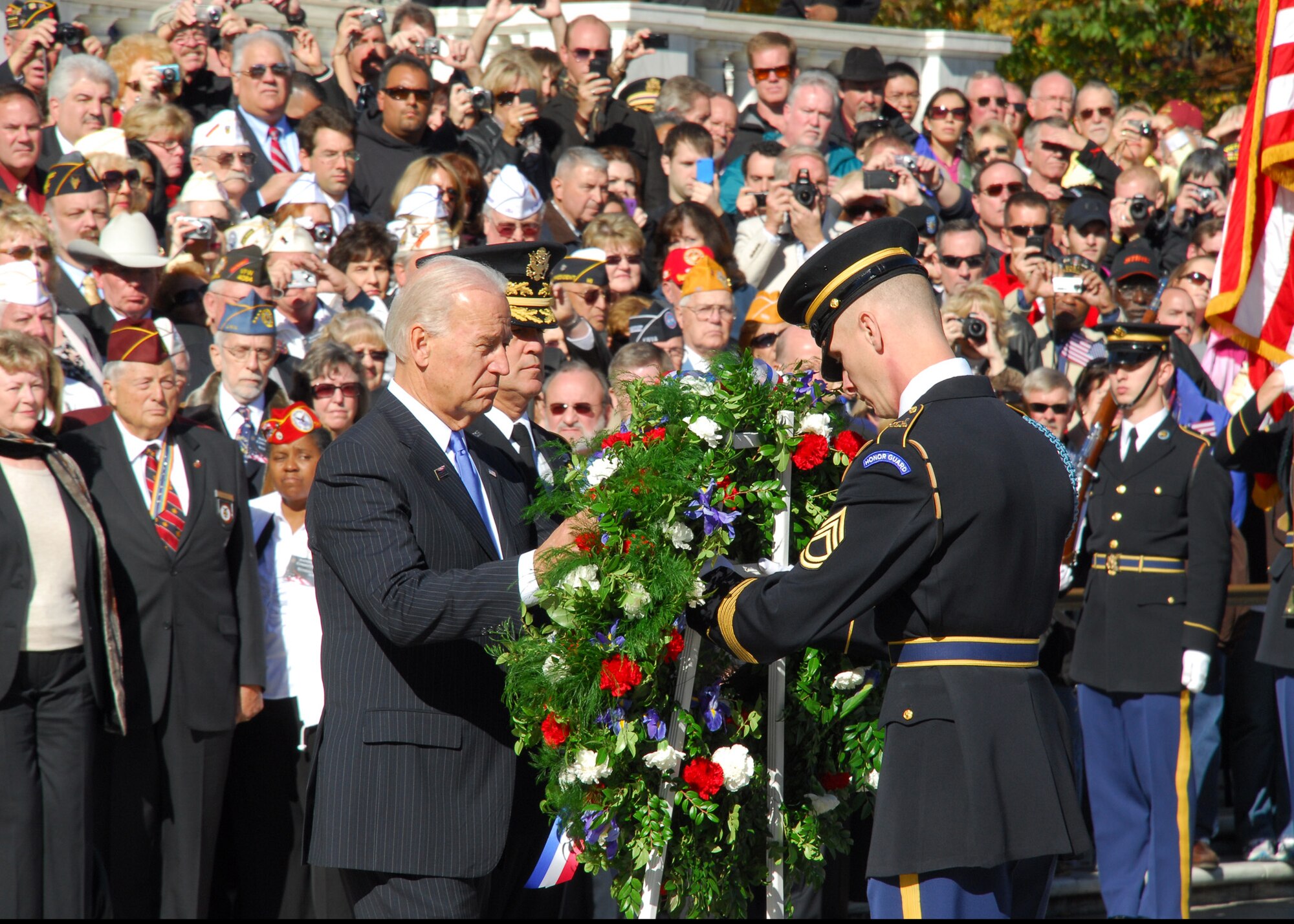 Vice President Joe Biden helps position a wreath at the Tomb of the Unknowns Nov. 11, 2010, during the Veterans Day ceremony at Arlington National Cemetery in Arlington, Va.  Many senior Department of Defense leaders attended the event along with hundreds of visitors and veterans. (U.S. Air Force photo/Master Sgt. Raheem Moore)