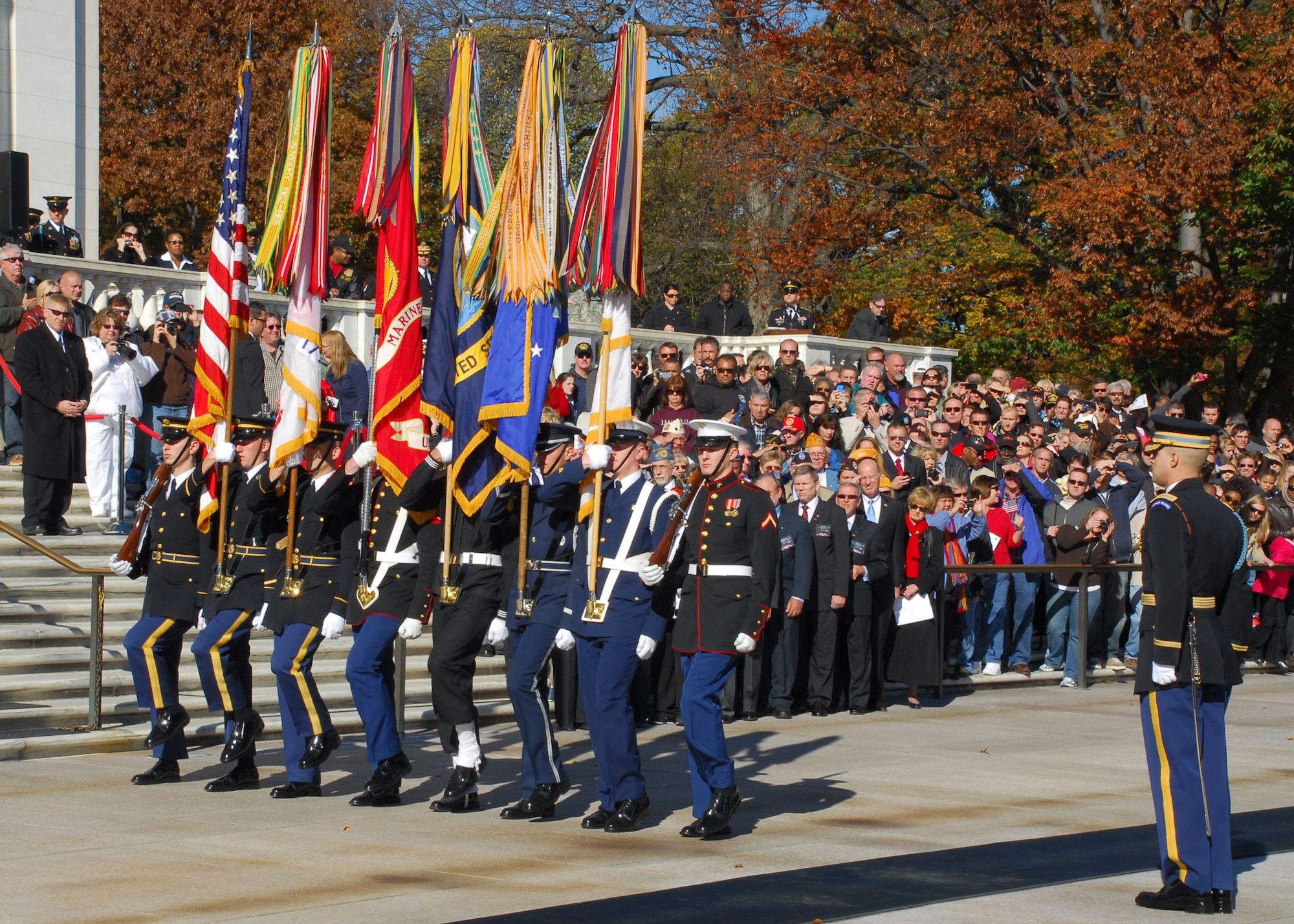 Members of the joint service color guard prepare to post the colors at a wreath-laying presentation at the Tomb of the Unknowns Nov. 11, 2010, during the Veterans Day ceremony at Arlington National Cemetery in Arlington, Va.  Many senior Department of Defense leaders attended the event along with hundreds of visitors and veterans. (U.S. Air Force photo/Master Sgt. Raheem Moore) 