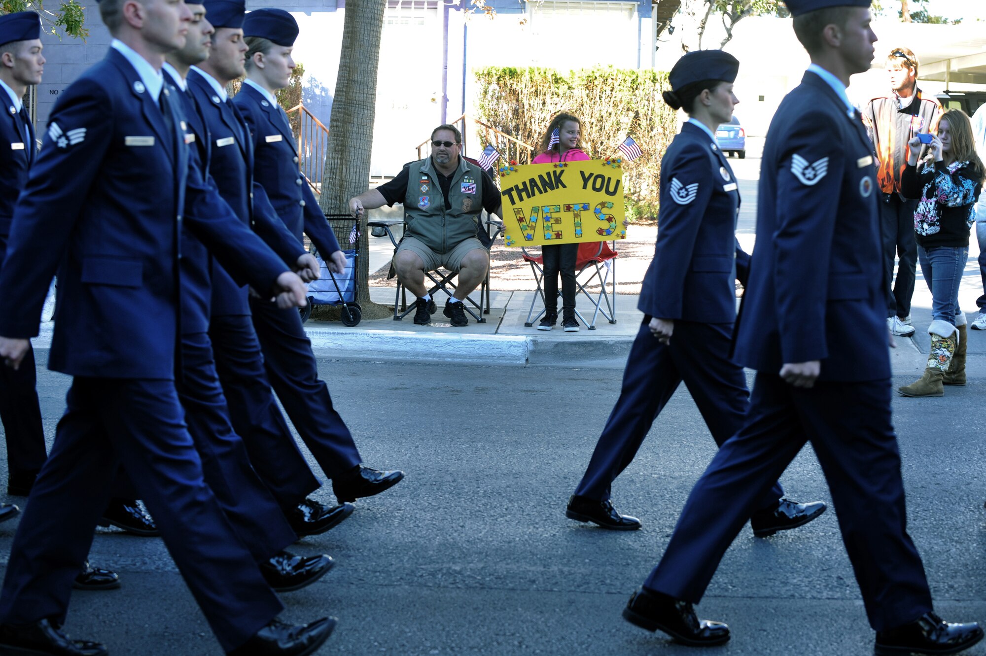 LAS VEGAS -- Nellis Air Force Base Nev., Airman Leadership School students march in the Las Vegas Veterans Day Parade while spectators show their appreciation  Nov. 11, 2010. Airmen from the U.S. Air Force Honor Guard also participated in the parade. (U.S. Air Force photo / Airman 1st Class Daniel Hughes)(Released)
