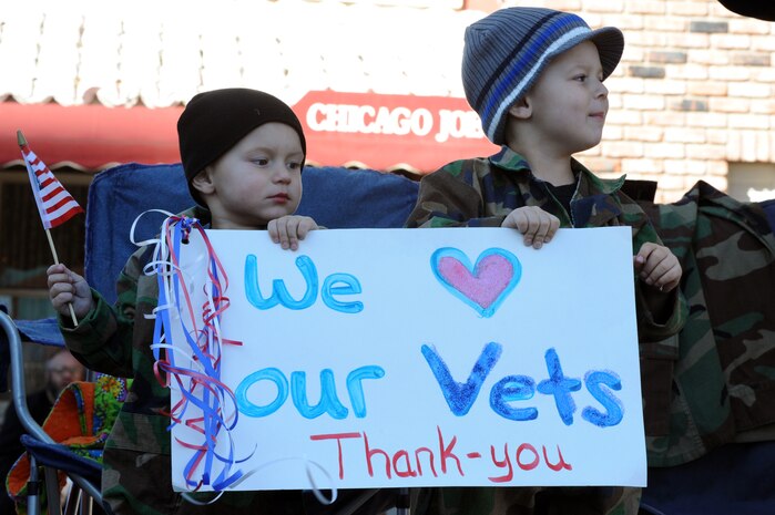 LAS VEGAS -- Chase and Tyler Ludlow show their appreciation during the Las Vegas Veterans Day Parade Nov. 11, 2010. Airmen from the U.S. Air Force Honor Guard and Nellis Air Force Base participated in the parade. (U.S. Air Force photo / Airman 1st Class Daniel Hughes)(Released)
