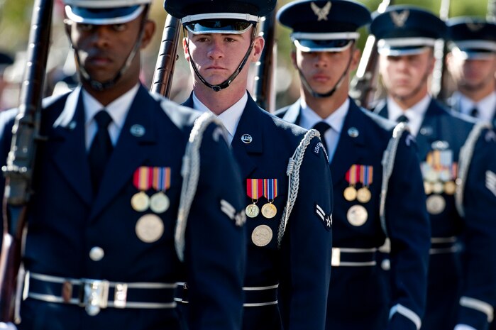 LAS VEGAS -- Airmen from the U.S. Air Force Honor Guard march and perform during the Las Vegas Veterans Day Parade Nov. 11, 2010. Airmen from Nellis Air Force Base, Nev., Airman Leadership School also participated in the parade.  (U.S. Air Force photo / Tech. Sgt. Michael R. Holzworth)(Released)