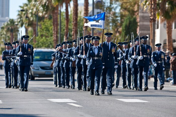 LAS VEGAS -- Airmen from the U.S. Air Force Honor Guard march and perform during the Las Vegas Veterans Day Parade Nov. 11, 2010. Airmen from Nellis Air Force Base, Nev., Airman Leadership School also participated in the parade.  (U.S. Air Force photo / Tech. Sgt. Michael R. Holzworth)(Released)