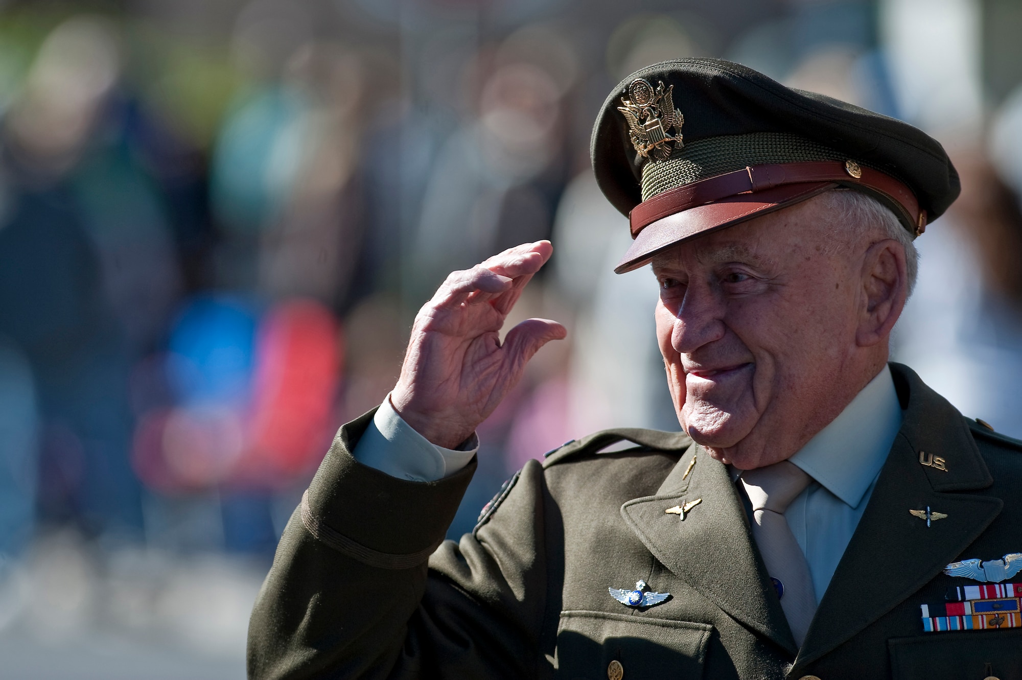 LAS VEGAS -- World War II fighter pilot Jack Schofield salutes the crowd during the Las Vegas Veterans Day Parade Nov. 11, 2010. Mr. Schofield retired from the military as a lieutenant colonel and was a member of the famous fighter squadron known as the "Flying Tigers." Airmen from the U.S. Air Force Honor Guard and Nellis Air Force Base, Nev., participated in the parade.  (U.S. Air Force photo / Tech. Sgt. Michael R. Holzworth)(Released)