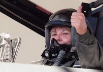 SEYMOUR JOHNSON AFB, NC -- Gold Star Mother Janet Monti gives the thumbs-up before taking flight in an F-15E Strike Eagle. Her son, Jared, always wanted to be a pilot, but joined the Army instead. So Wednesday, more than four years after his heroic death in Afghanistan, his mother was given a chance to live her son's dream.  (Courtesy photo/News-Argus/Michael K. Dakota)