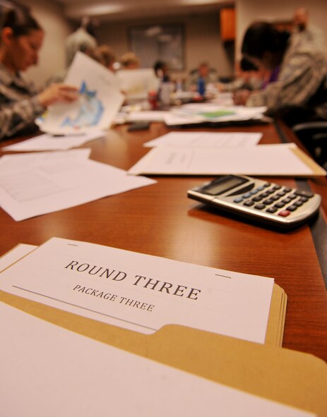 MOODY AIR FORCE BASE, Ga. -- One of the folders containing posters for the Air Show LOGO CONTEST lies on the table during a judging session Nov. 9. The judging panel was made up of 14 Airmen from different base agencies and took an estimated two hours to judge. (U.S. Air Force photo/Airman 1st Class Joshua Green)(RELEASED)
