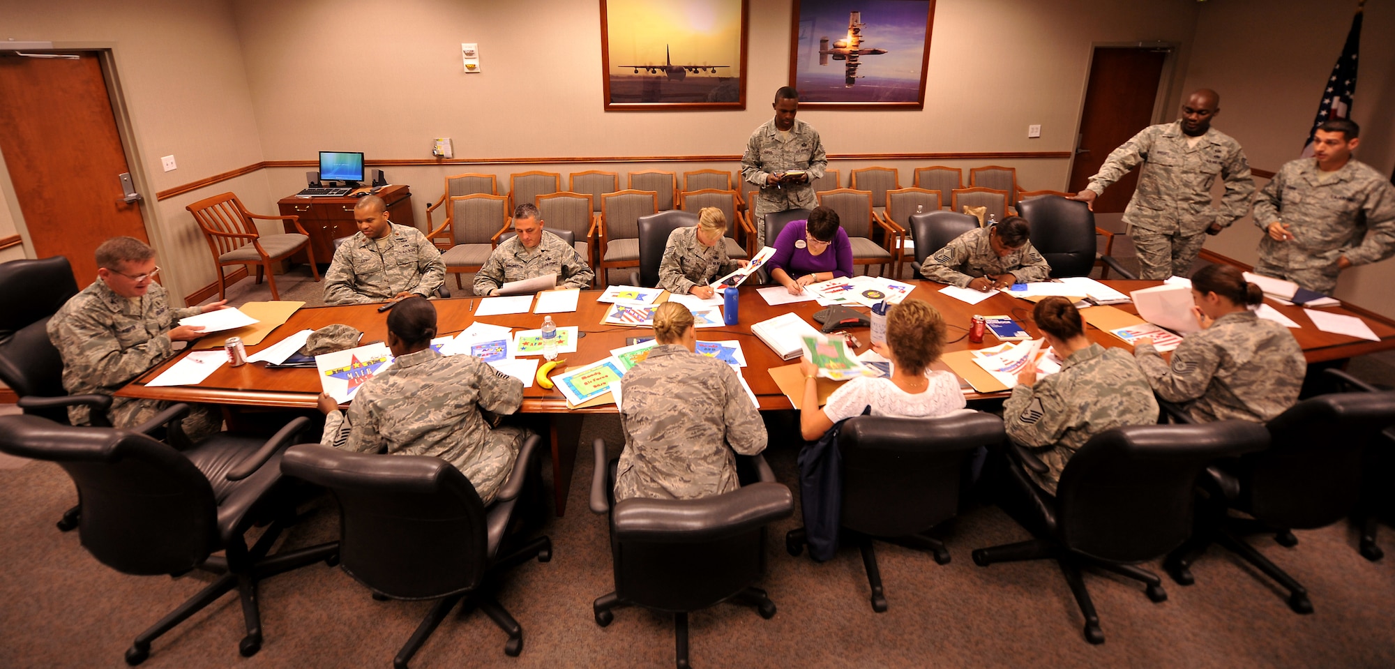 MOODY AIR FORCE BASE, Ga. -- Airmen from different base agencies came together to judge posters for the Airshow LOGO CONTEST here Nov. 9. The posters were submitted from children from Lowndes Middle School and the winner of the contest will be announced Nov. 11 at the middle school by the base commander. (U.S. Air Force photo/Airman 1st Class Joshua Green)(RELEASED)
