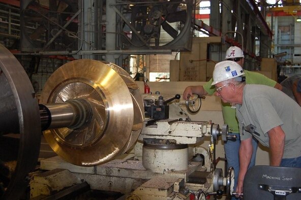 ATA Utility Machinist David Stewart operates a large lathe in the Model Shop. He is machining the shaft assembly supporting the recently fabricated impeller for a pump that is located in AEDC’s Secondary Pumping Station. (Photo provided)