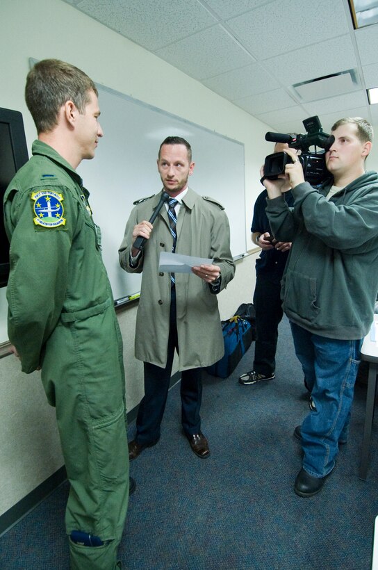 ANDREWS AIR FORCE BASE, Md. – Eric M. Sharman, 11th Wing Public Affairs chief of media, asks 1st Lt. Mitch Clapp, 1st Helicopter Squadron pilot, hard-hitting questions during a mock interview, while Senior Airman Bryan Truskolaski, 11 WG/PA broadcaster, applies pressure by aiming his camera and videotaping Lieutenant Clapp. The purpose of the training course was aimed at preparing junior officers to handle media queries at the education building Nov. 3. The course was one of several courses taken during the Lieutenant’s Professional Development Program held Nov.3 through 5. (U.S. Air Force photo/Bobby Jones)