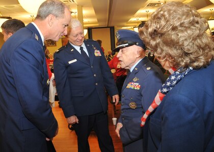 BELLEVUE, Neb. - Gen. Kevin Chilton, U.S. Strategic Command commander, and Chaplain (Col.) Carl Swanson, 55th Wing chaplain, share a lighter moment with a retired Air Force veteran during a Veterans Day ceremony held at the Eastern Nebraska Veterans&#039; Home Nov. 11.  (U.S. Air Force photo)