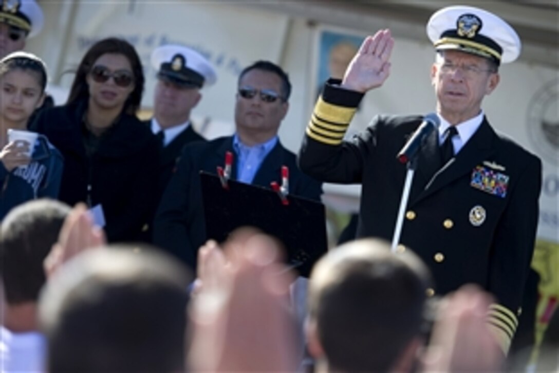 U.S. Navy Adm. Mike Mullen, chairman of the Joint Chiefs of Staff, swears in Navy recruits at the 7th Annual San Fernando Valley Veterans Day Parade in Los Angeles, Nov. 11, 2010.