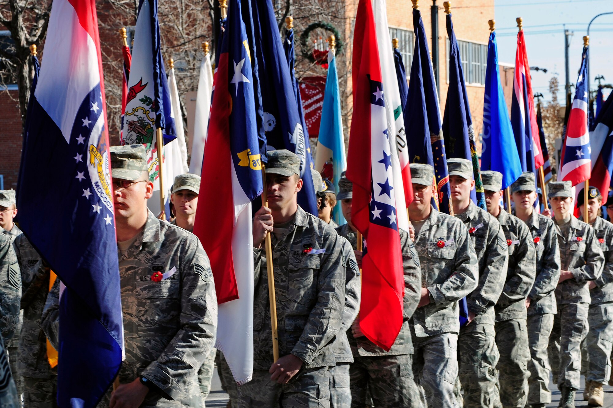 Airmen assigned to Ellsworth Air Force Base march down Main Street, Rapid City, S.D., Nov. 11.  Each Airman carried a flag to honor each of the United States of America. (U.S. Air Force photo/Staff Sgt. Marc I. Lane)