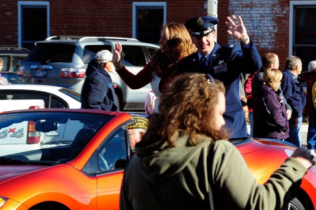 Col. Jeffrey Taliaferro, 28th Bomb Wing commander, waves to the crowd during the Veterans Day parade down Main Street, Rapid City, S.D., Nov. 11.  Col. Taliaferro acted as the grand marshal of the parade.  (U.S. Air Force photo/Staff Sgt. Marc I. Lane)