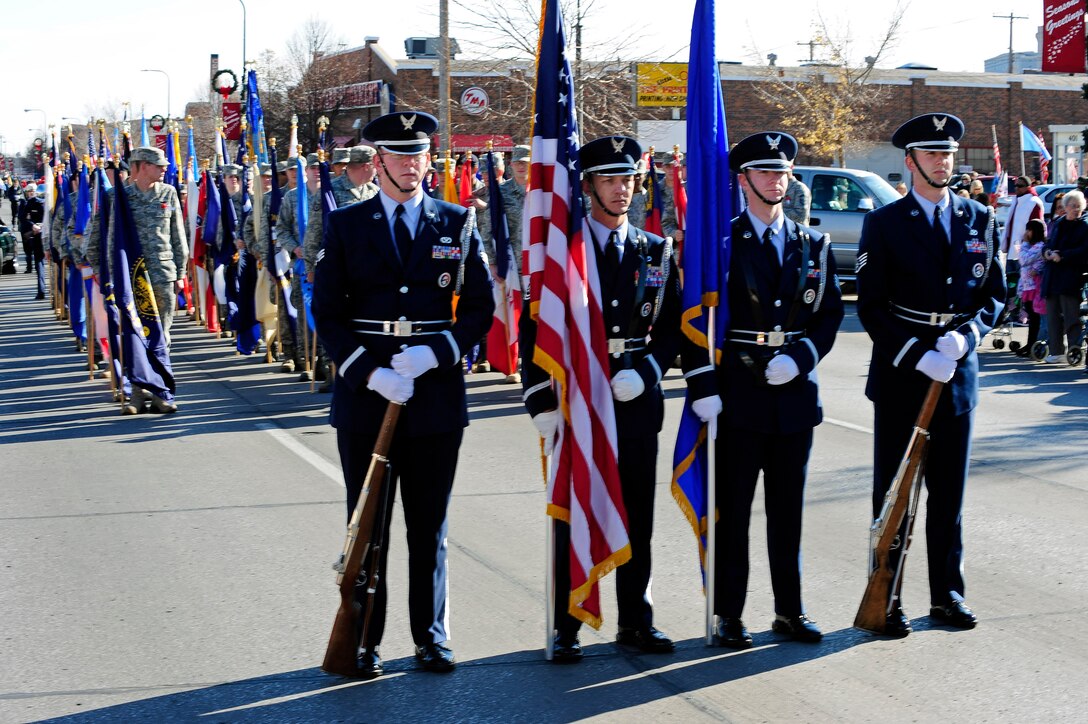 Members of the Ellsworth Honor Guard stand ready for the Veterans Day parade to begin on Main Street, Rapid City, S.D., Nov. 11.  Veterans Day is an opportunity to remember and honor all of America’s military members, past and present. (U.S. Air Force photo/Staff Sgt. Marc I. Lane)
