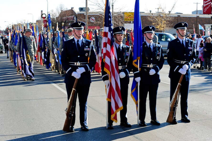 Members of the Ellsworth Honor Guard stand ready for the Veterans Day parade to begin on Main Street, Rapid City, S.D., Nov. 11.  Veterans Day is an opportunity to remember and honor all of America’s military members, past and present. (U.S. Air Force photo/Staff Sgt. Marc I. Lane)