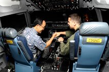 JOINT BASE PEARL HARBOR-HICKAM, Hawaii - Consulate General of Japan Yoshihiko Kamo greets Capt. Joseph Monaco, 15th Wing executive officer, before a C-17 simulator demonstration, Nov. 10. Consul General Kamo visited 13th Air Force headquarters and the 15th Wing during his visit to Joint Base Pearl Harbor-Hickam. (Photo by David D. Underwood Jr.)
