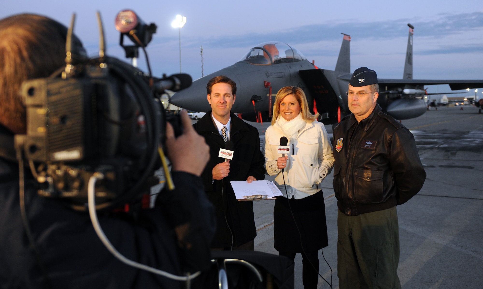 MOUNTAIN HOME AIR FORCE BASE, Idaho – Mike Murad and Natalie Hurst, KBOI Channel 2 News anchors, interview Col. Ron Buckley, 366th Fighter Wing commander, in front of an F-15E Strike Eagle on the flightline here on Veteran’s Day Nov. 11. (U.S. Air Force photo by Senior Airman Debbie Lockhart)(Released) 