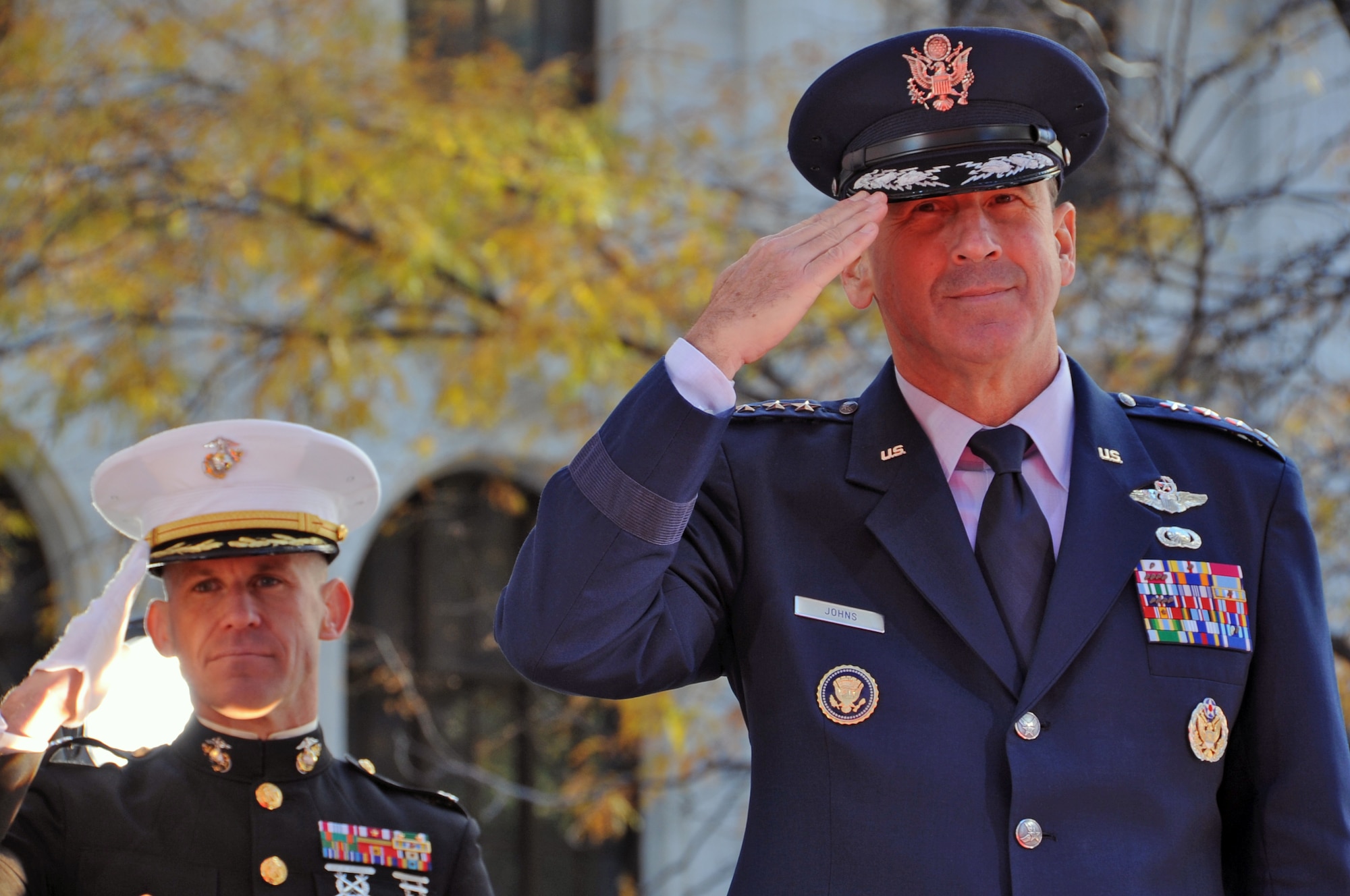 NEW YORK -- Gen. Raymond Johns, Air Mobility Command commander, renders a salute to a passing flight of servicemembers during the 2010 New York City Veterans Day Parade Nov. 11. General Johns was a guest to the review stand during this year’s parade. (U.S. Air Force photo/Senior Airman David Carbajal)